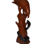 wooden eagle holding a serpent